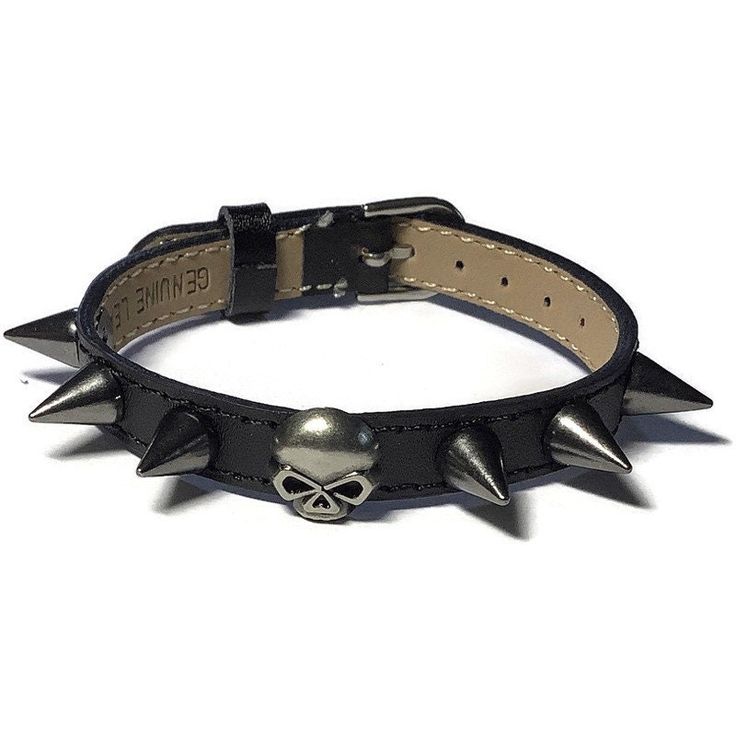 "Love skulls?  You'll love this bracelet! It's a real eye catcher! It has an antique silver/gunmetal skull head  stud with round spikes evenly spaced across the center of a genuine black leather buckle bracelet wristband strap. This black leather buckle wristband bracelet strap is 10mm wide and about 8 inches long.   It can fit a wrist from 5.5\"  to 7.5\" around.  The strap is made of Genuine leather material and are stamped as such on the back. They are sewn around the edges for more durabilit Spike Wristband, Bracelet Leather, Heavy Metal Accessories, Adjustable Gothic Leather Bracelet With Spikes, Adjustable Spiked Grunge Jewelry, Adjustable Grunge Jewelry With Spikes, Edgy Adjustable Leather Bracelet For Gifts, Edgy Adjustable Leather Bracelet As Gift, Adjustable Rock Style Leather Bracelet For Gift