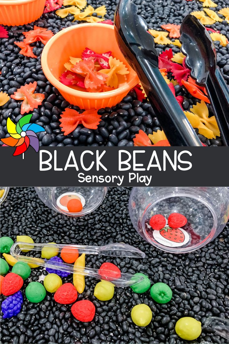 black beans and candy in plastic containers with spoons on the ground next to them