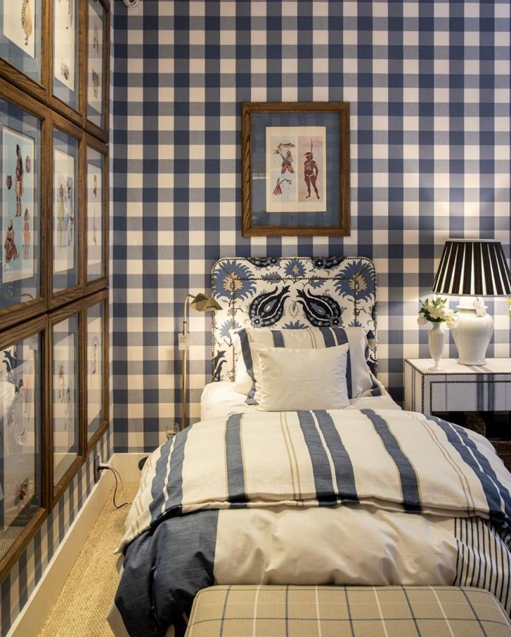 a bedroom with blue and white checkered walls