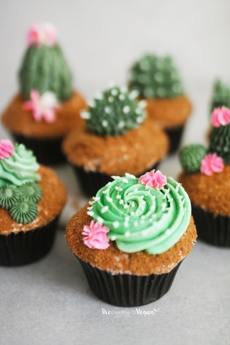 cupcakes decorated with green frosting and cacti