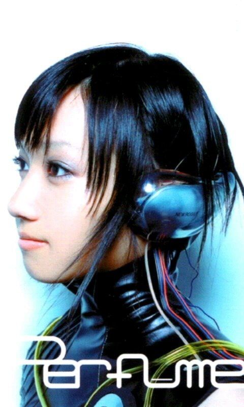 a woman with black hair and headphones on