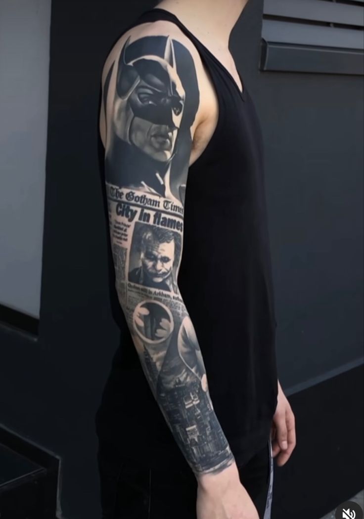 a man with a batman tattoo on his arm