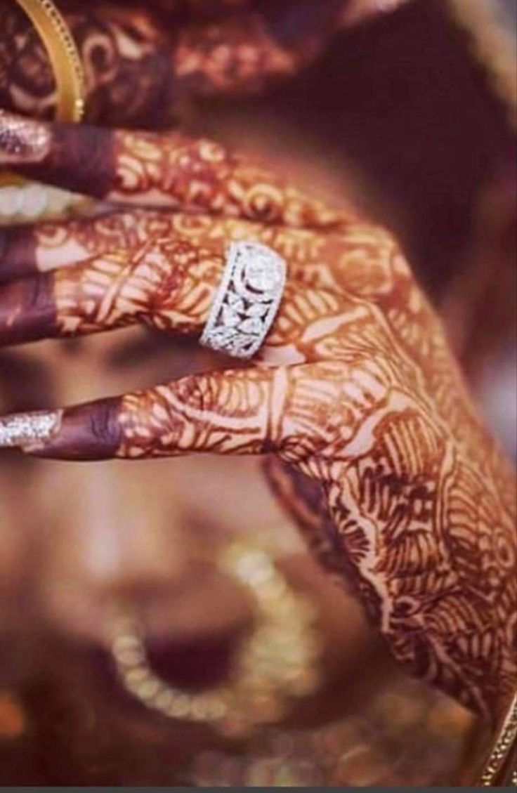 a woman's hand with hendi designs on it and the words new mehndi designs unique 2020