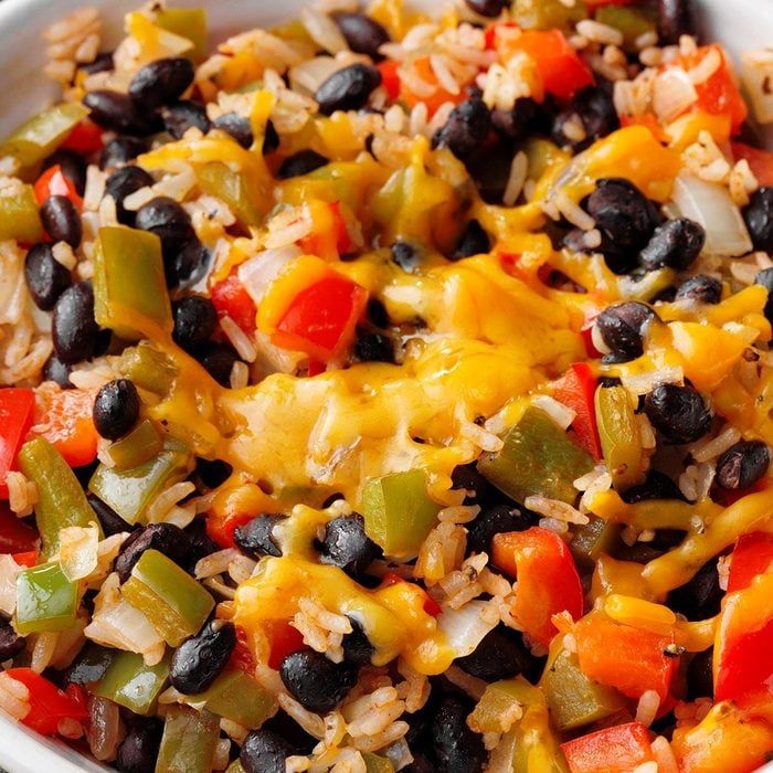 a white bowl filled with rice and black beans