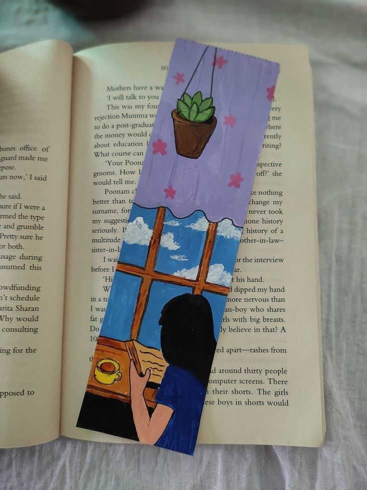 an open book with a drawing of a person looking out the window and holding a plant