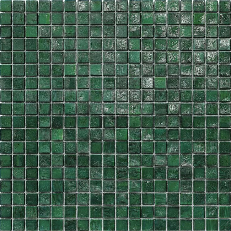 a green glass tile wall that looks like it is made out of tiles