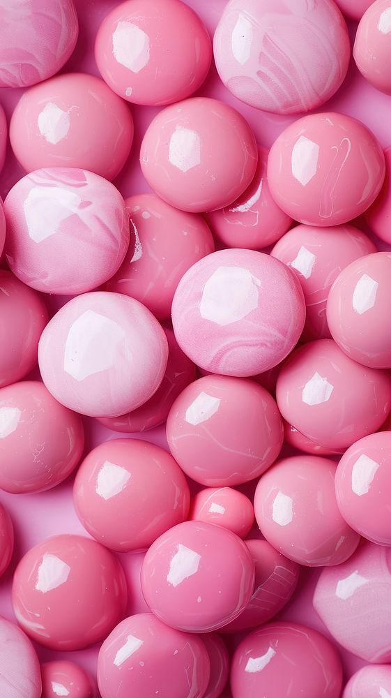 pink candy balls are shown in close up