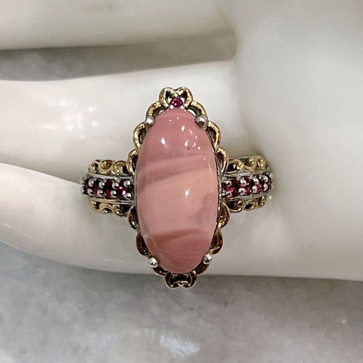 Elongated Oval Australian Pink Opal Set In Sterling Silver With 14k Yg And Platinum Overlay. Each Side Of Band Has 4 Orissa Rhodolite Garnet Accent Stones With A Single Accent Stone On The Top And Bottom Marked 925 Size 8 Opal And Garnet Ring, Oval Red Gemstones With Accents, Garnet And Rhodonite, Rhodolite Garnet Ring, Rhodolite Garnet, Garnet Rings, Pink Opal, Womens Jewelry Rings, Garnet