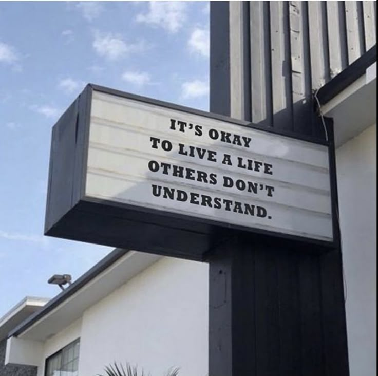 a sign that says it's okay to live a life others don't understand