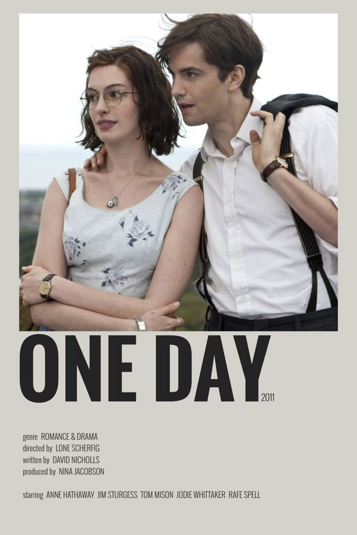 a man and woman standing next to each other in front of a one day poster