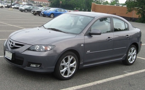 a gray car parked in a parking lot