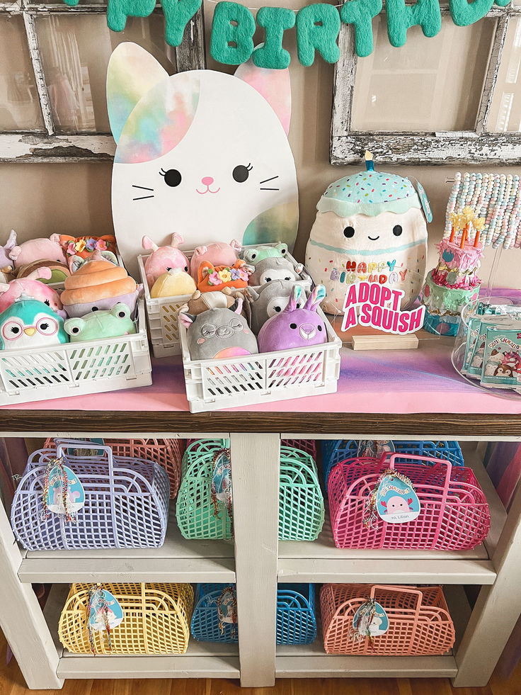 a table with baskets and stuffed animals on it