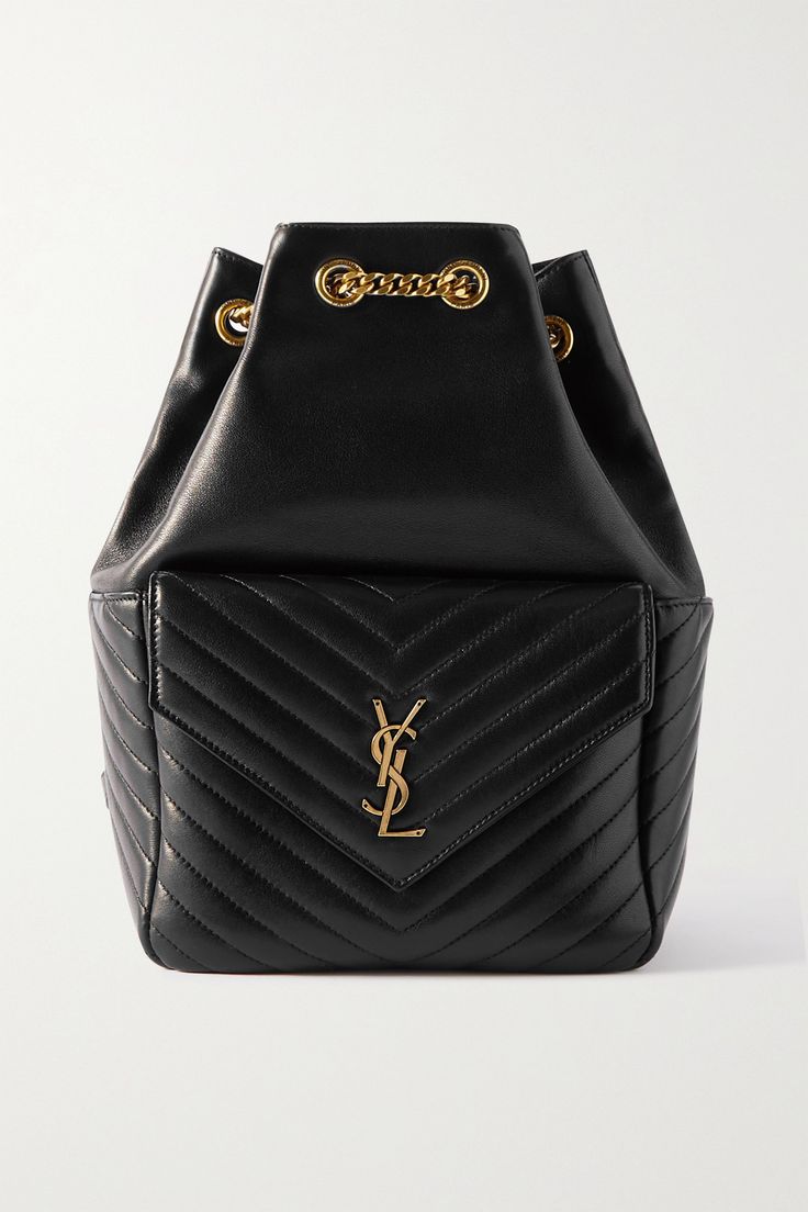 SAINT LAURENT's 'Joe' backpack is crafted from supple black leather with signature chevron quilting and topped with the 'YSL' monogram. Made in Italy, it's embellished with a chain-link drawstring. Keep your essentials stashed in the front pouch for easy access and the rest secured in the interior zipped pocket. Gucci Drawstring Backpack, Ysl Backpack, Hang Bags, Designer Backpack, Ysl Bags, Mini Mochila, Indie Jewelry, Hot Bags, Black Leather Backpack