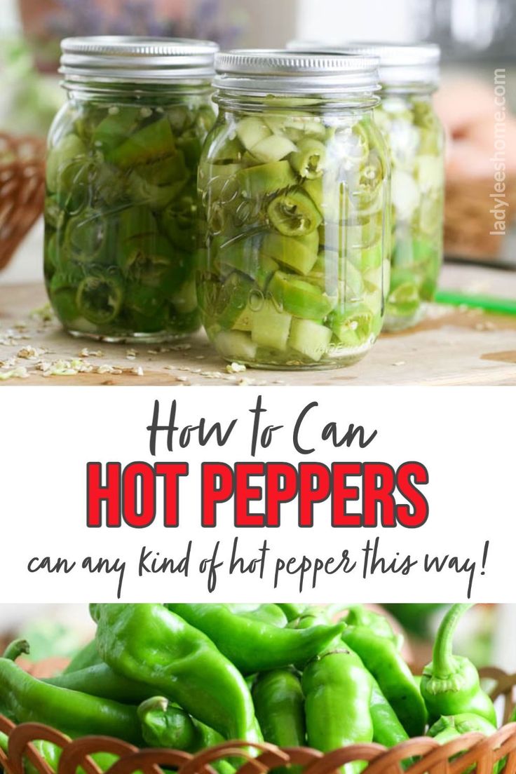 jars filled with green peppers sitting on top of a table