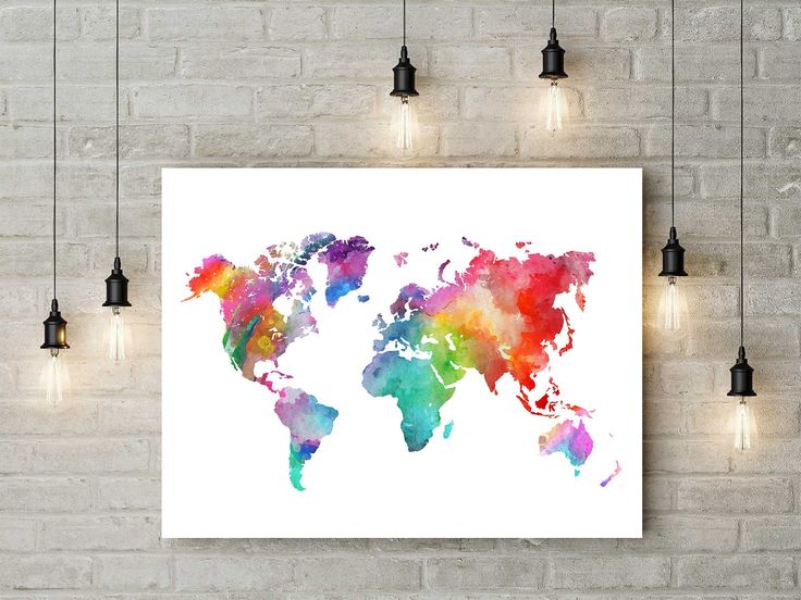 a colorful map of the world hanging on a wall in an empty room with lights