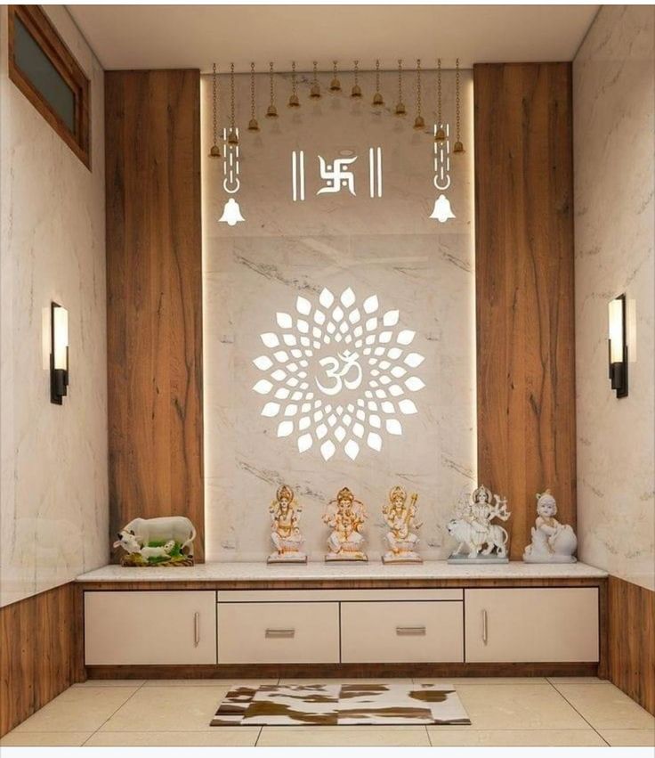 a white and brown room with buddha statues on the wall, chandelier and lights