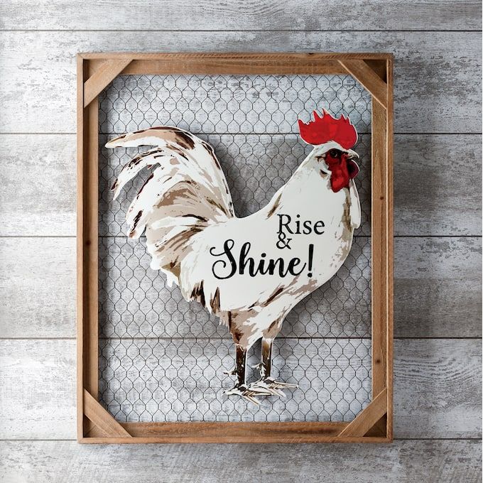 a wooden frame with a rooster on it and the words rise and shine painted on it