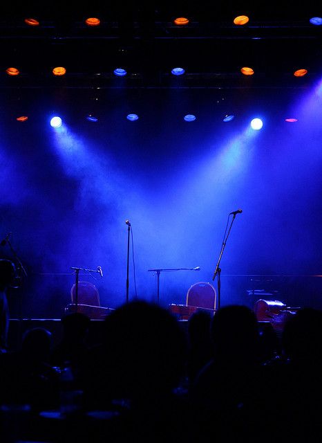 the stage is lit up with bright blue lights