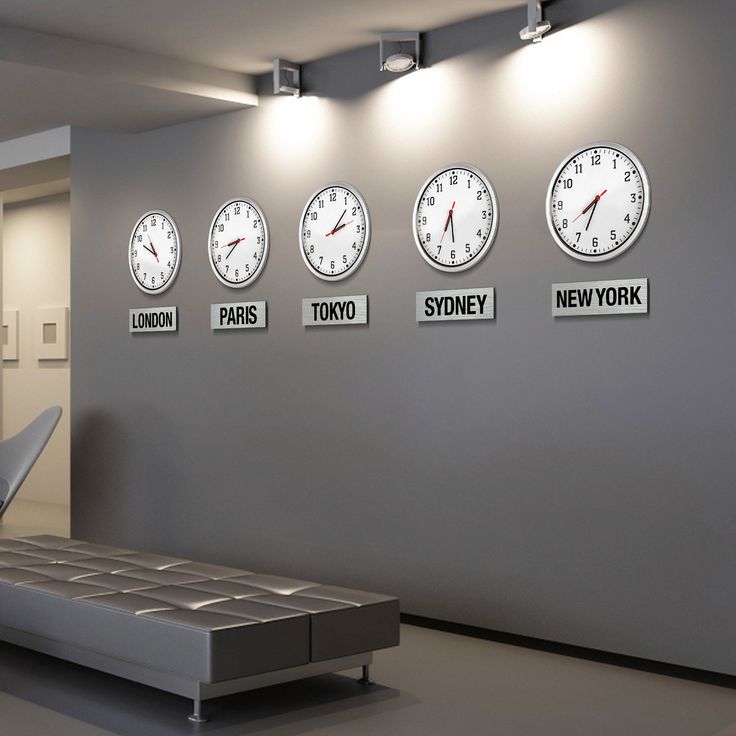 clocks on the wall in an office waiting area