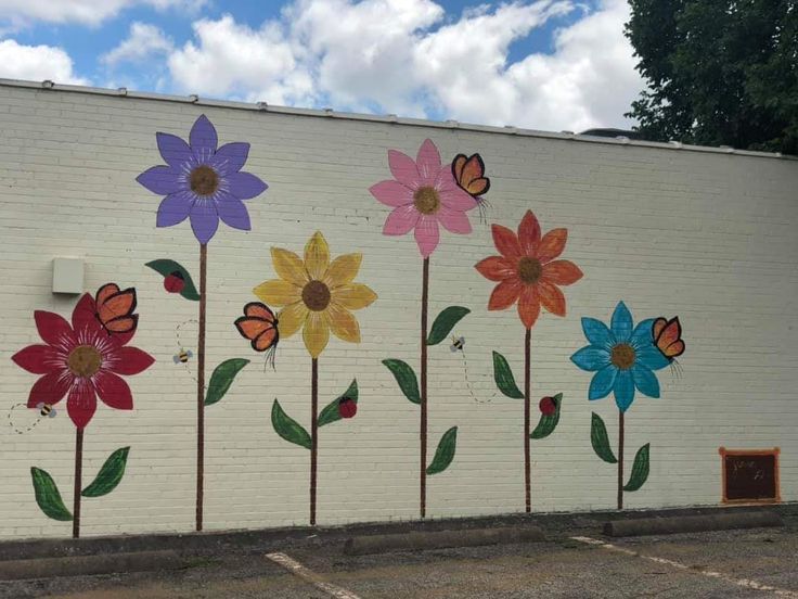 painted flowers on the side of a building