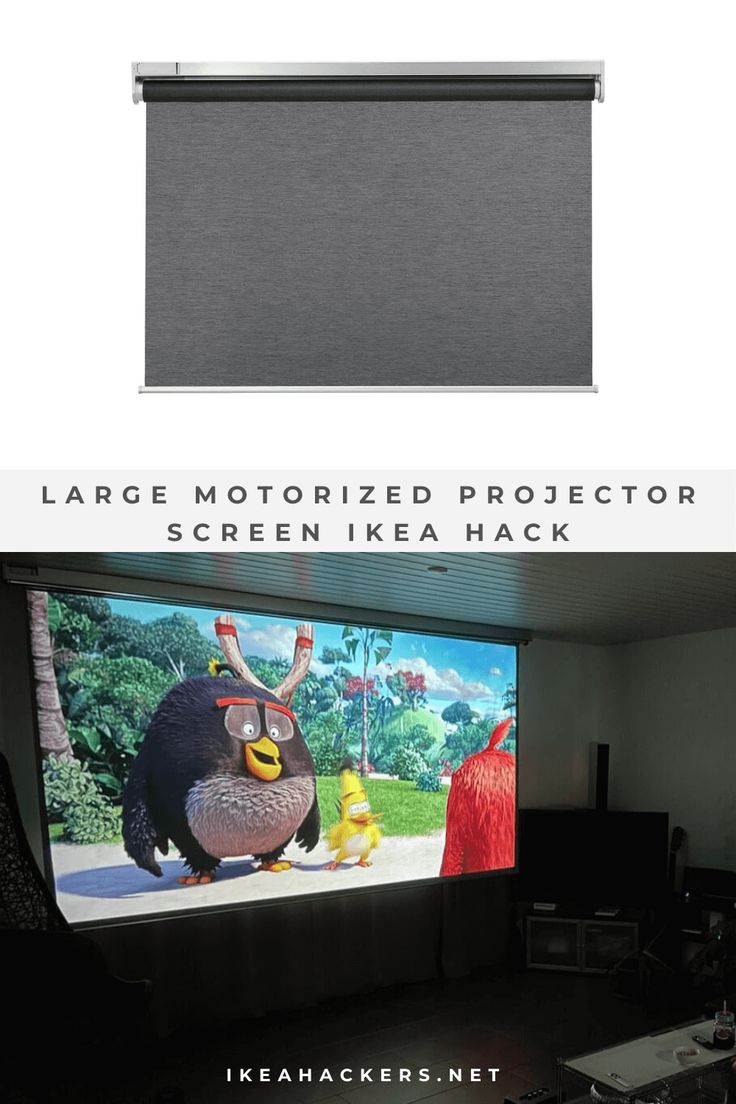 a large screen in the corner of a room that has an angry bird on it