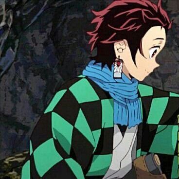 an anime character with red hair wearing a green and black checkered sweater holding a box