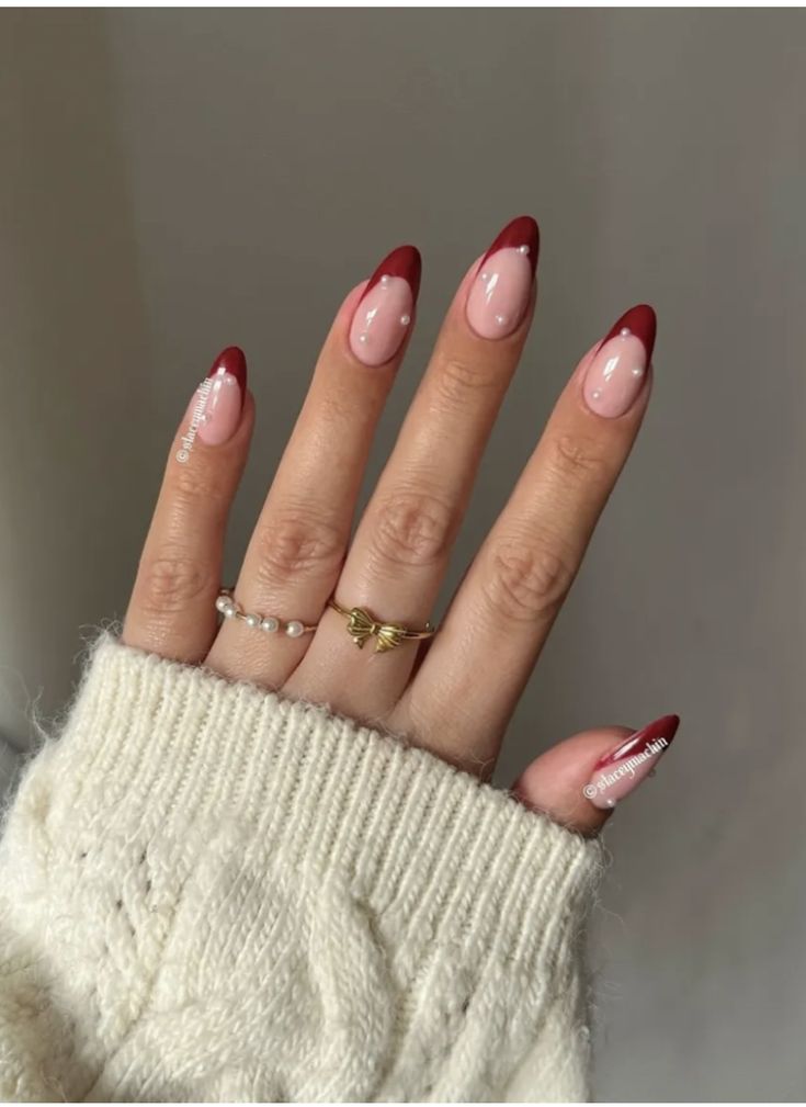 Red Christmas Nails With Pearls, French Nail Designs Christmas, Red Pearly Nails, Red Christmas Nails Winter French Tips, Pearl Nails Christmas, Red Nail Almond Shape, Red French With Pearls, Christmas Almond French Tip Nails, Christmas Nail Ideas French Tips