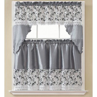 a window with a curtain and valance on it