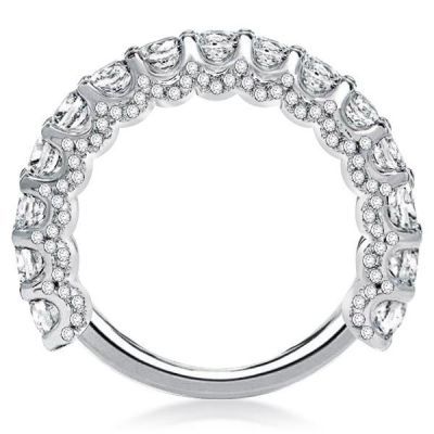 a white gold ring with rows of diamonds on the sides and an oval design in the middle