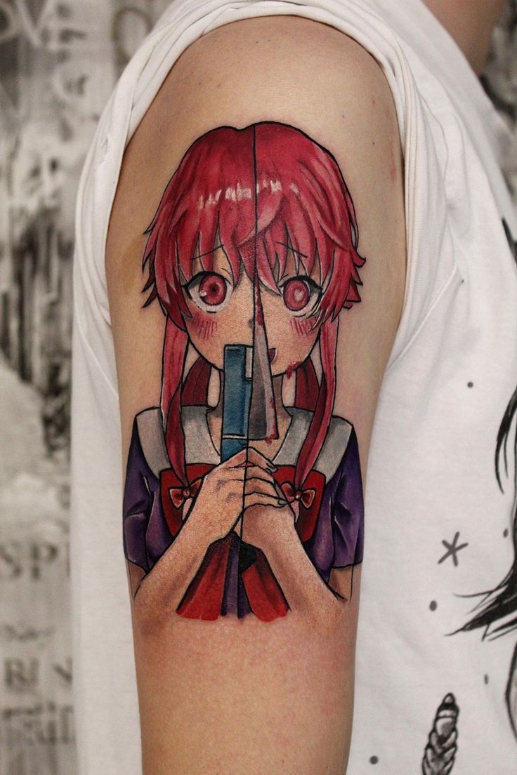 a girl with red hair holding a camera tattoo on her arm