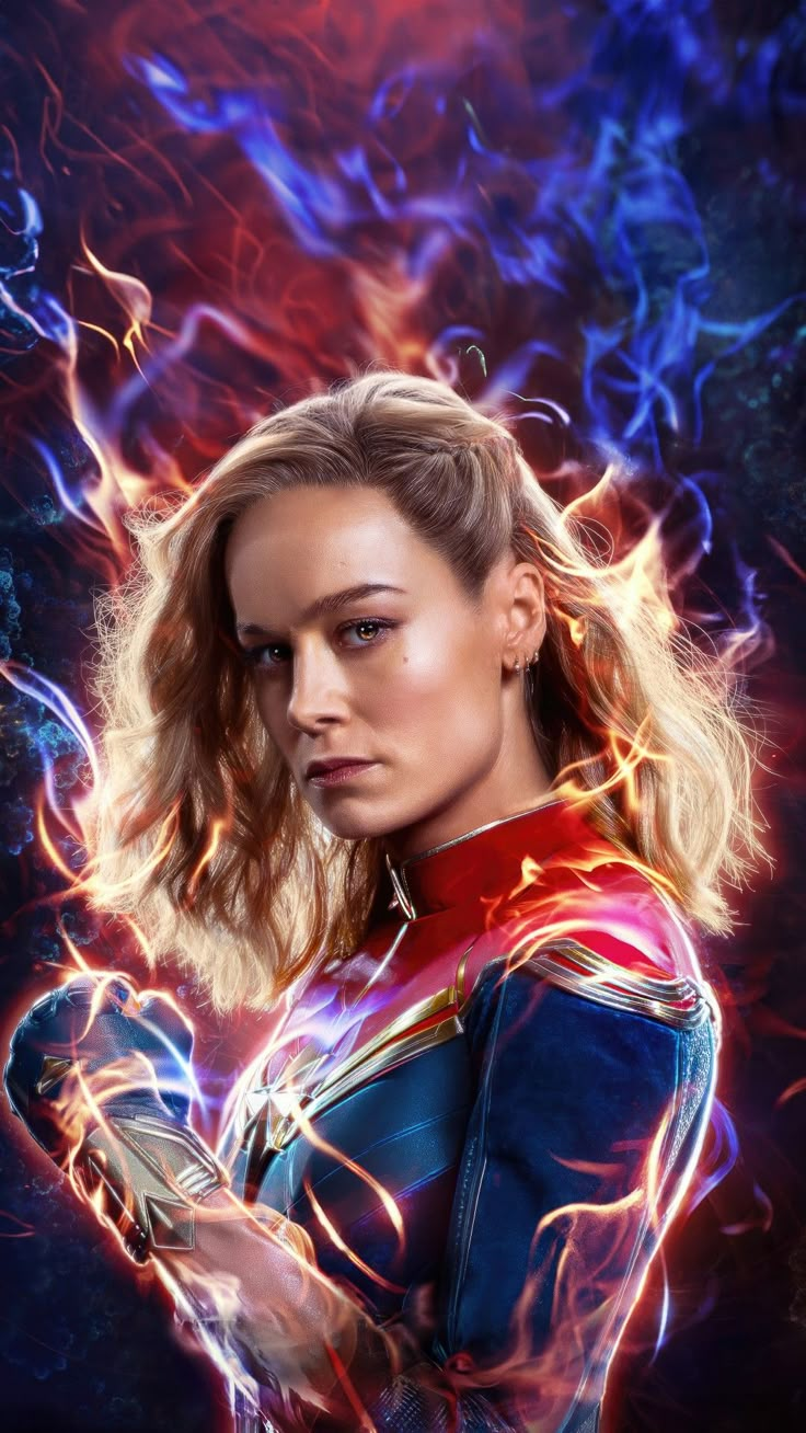 captain marvel 2 poster with the avengers logo on it's chest and arms crossed