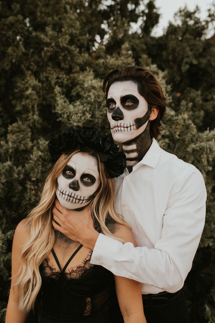 a man and woman with skeleton makeup on their faces