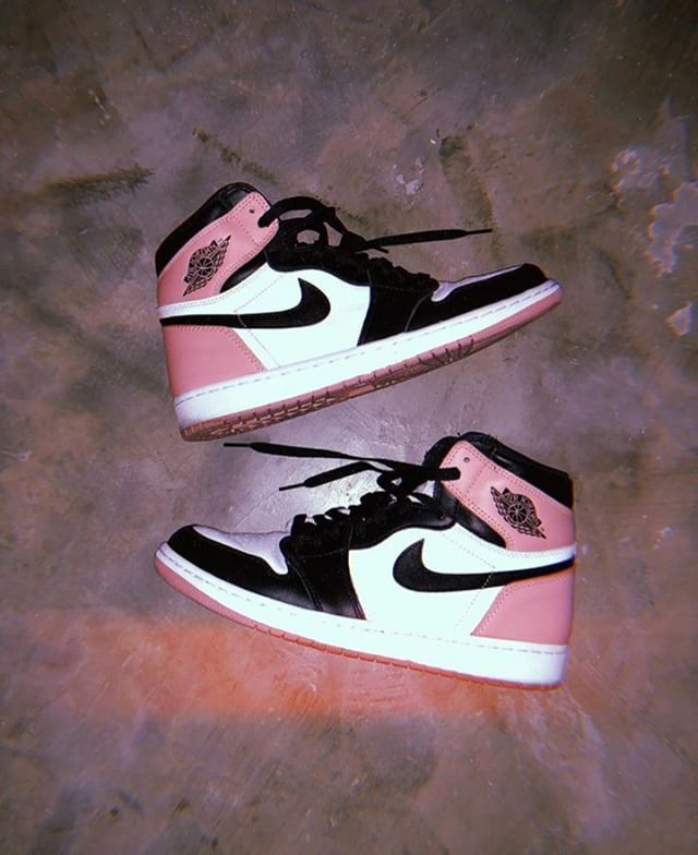 pair of pink and black air jordan sneakers