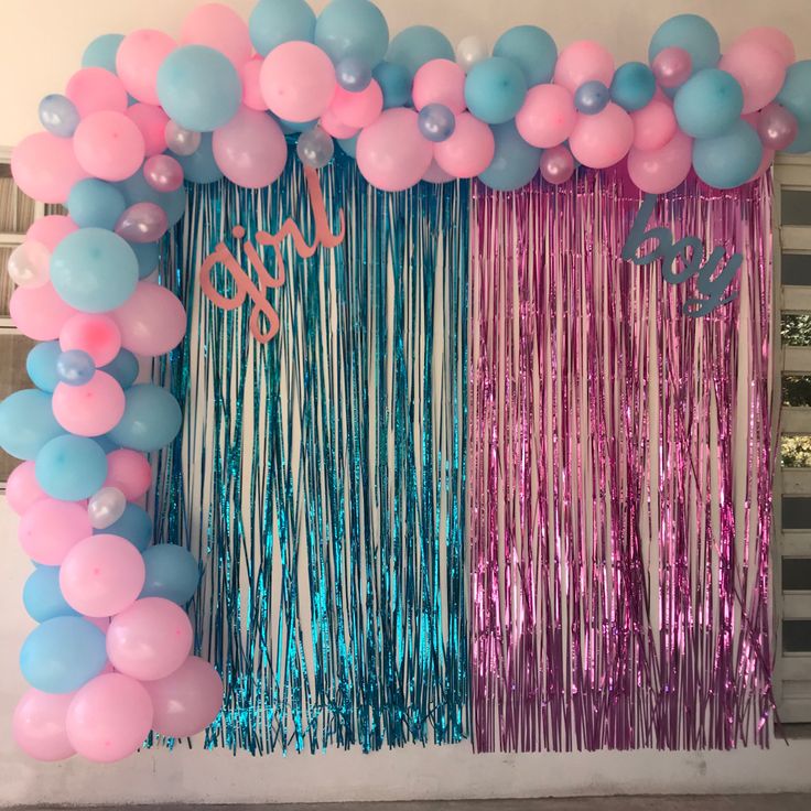 balloons and streamers decorate the backdrop for a party