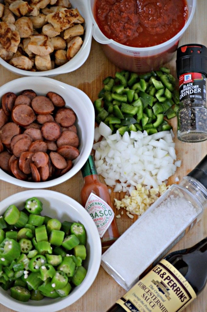 the ingredients are laid out on the table to make this meal, including hot dogs and peppers