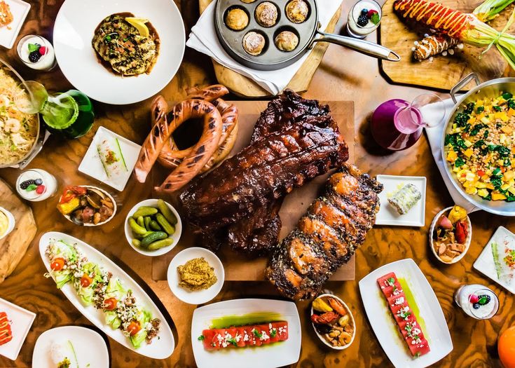 a table topped with lots of different types of food