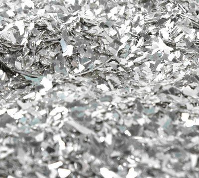 a pile of silver foil sitting on top of a table