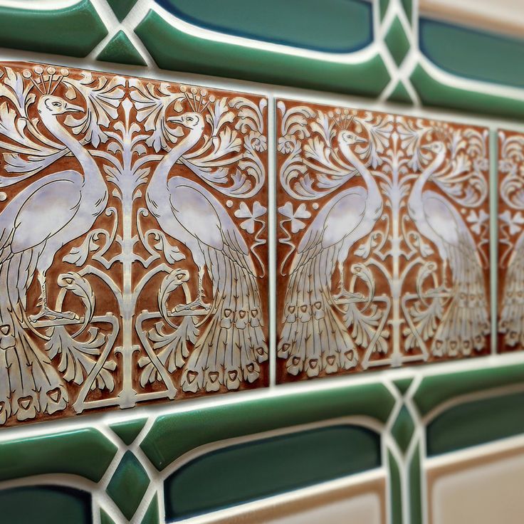 an intricately designed tile with peacocks on it's backsplashes