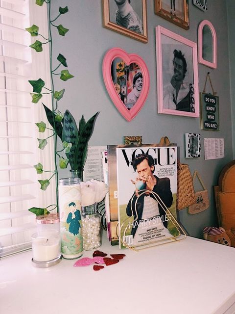 a white table topped with pictures and candles