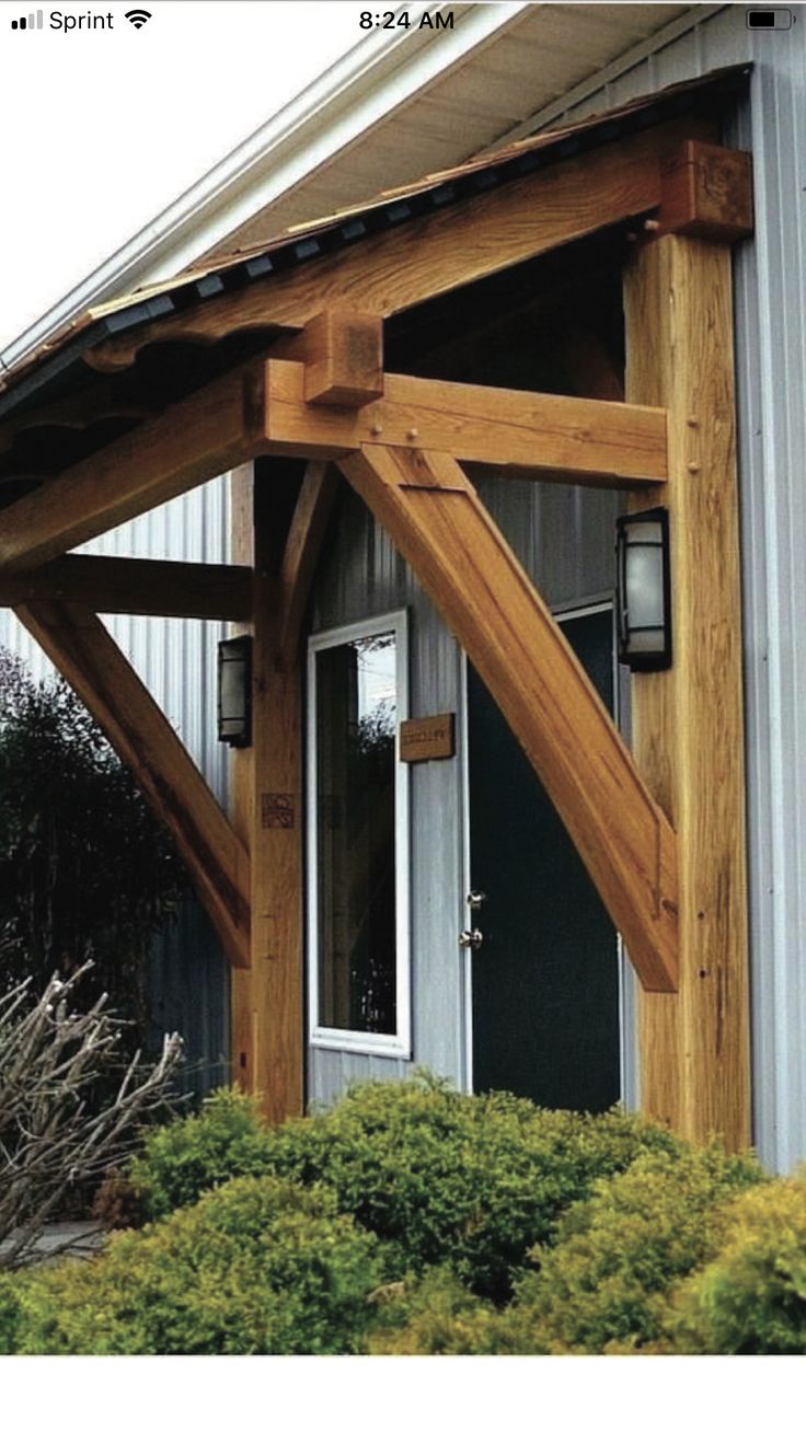 a house with a wooden roof and white door