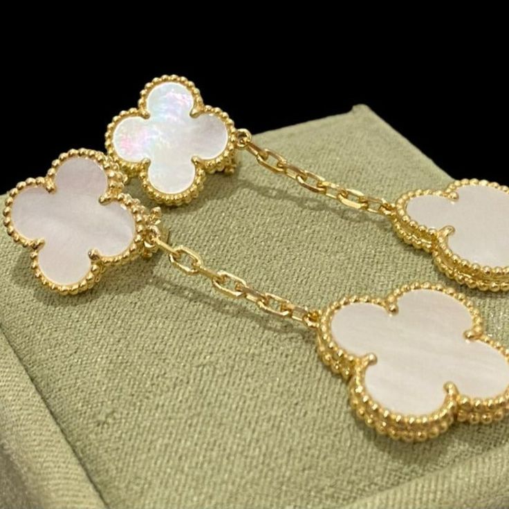 Discover the elegance of these Clover White MOP Earrings. Featuring two intricate motifs, these earrings are expertly crafted to add a touch of sophistication to any outfit. Made with premium materials, they offer timeless beauty and lasting durability. Elevate your style with these stunning earrings. ADDITIONAL INFORMATION Color: Silver Stone: Mother of pearl Ref. VCARO9II00 Material:- 925 Sterling Silver - 18k Gold Plated- 18k Real Gold ( contact us via instagram) Our replica products are comm Trinity Bracelet, Detailed Jewelry, Stunning Earrings, Love Bracelets, Love Necklace, Real Gold, Timeless Beauty, Beautiful Earrings, Mother Of Pearl