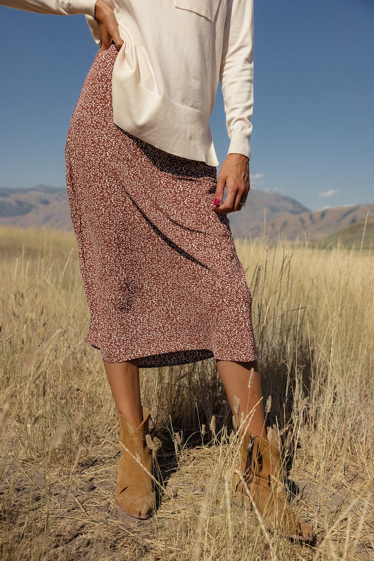 Adorned with a dainty print, this skirt brings a touch of feminine charm to any occasion. Whether you're dressing up for a special night out or keeping it casual, this skirt's timeless cut and pattern makes for the perfect style companion. slight high-low elastic waist unlined darkolivegreen (leopard print) // paired with a sweater coming soon saddlebrown (leopard print) // paired with the edinburgh cable knit sweater vest, the lydia denim jacket, + annette ballet flats in black black // paired Winter Lined Relaxed Skirt, Feminine Fall Midi Skirt, Brown Relaxed Fit Lined Skirt, Midi Skirt Fall Knitted, Sezane Midi Skirt, Fall Party Outfit, Athleisure Mom, Fall Wardrobe Essentials, Fall Attire