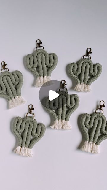 six green and white handmade key chains with tassels on each one side