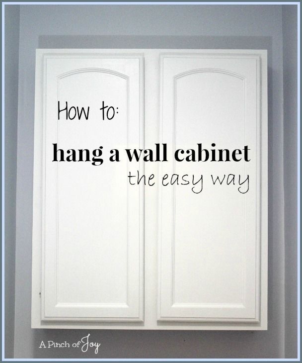 the words how to hang a wall cabinet the easy way are in black and white