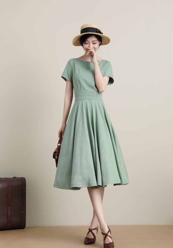 "DETAILS * 50% linen, 50% cotton blend * Has no lining * Two side Seam pockets * Boat neckline swing dress * High waist flared midi dress, Fitted waistband * Back zip closure * Perfect for Summer, Spring, autumn * Wash by hand or machine with cold water, Ironing after dry * The model is 170cm (5′7″) tall with a 80cm (31.5\") bust, 66cm (26\") waist. She is wearing the green dress in size XS. CUSTOM MADE SERVICE If you * Change other color * Can't find your size in our size Chart * Change the Len Retro Cotton Short Sleeve Midi Dress, 1950s Style Cotton Knee-length Dresses, 1950s Style Knee-length Cotton Dress, Cotton A-line Dress With Box Pleat, Vintage A-line Dress With Pockets, Classic Cotton Dresses With Pockets, Classic Cotton Dress With Pockets, Solid Color Vintage Cotton Dress, Casual Cotton A-line Vintage Dress