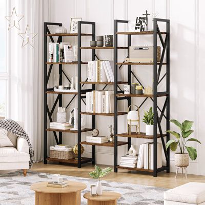 a living room filled with furniture and bookshelves