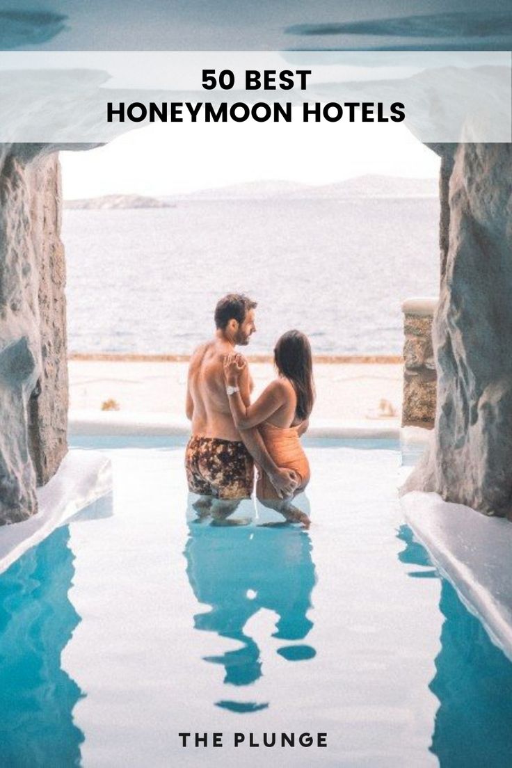 a man and woman sitting next to each other in front of a swimming pool with the words 50 best honeymoon hotels