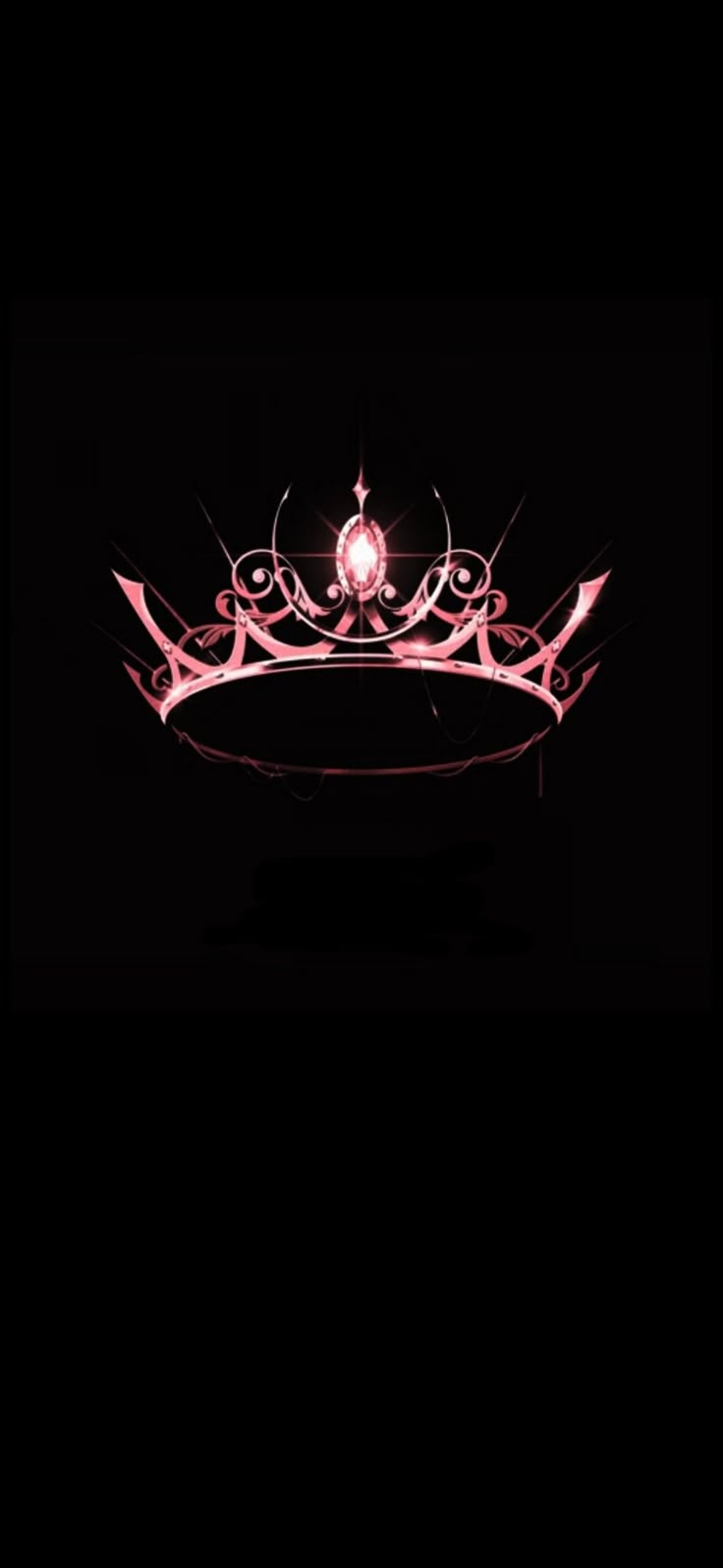 a pink tiara is lit up in the dark