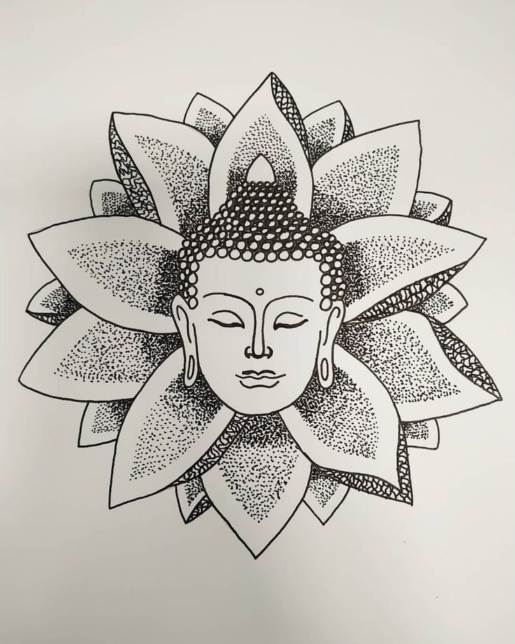 a drawing of a buddha face on a white paper with black and white inks