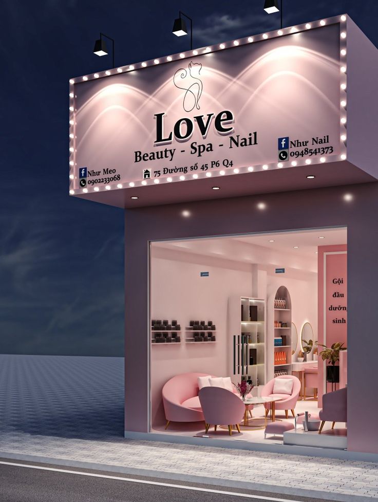 the front entrance to love beauty spa and nail salon at night with lights on it